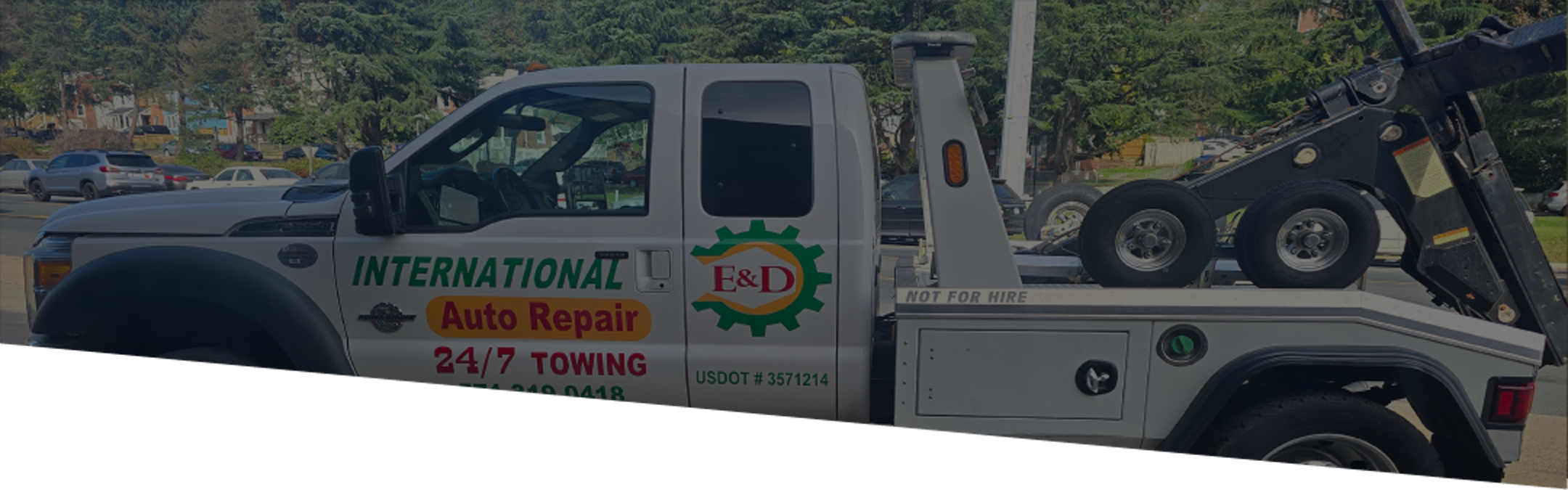 E and D international auto llc- tow truck banner